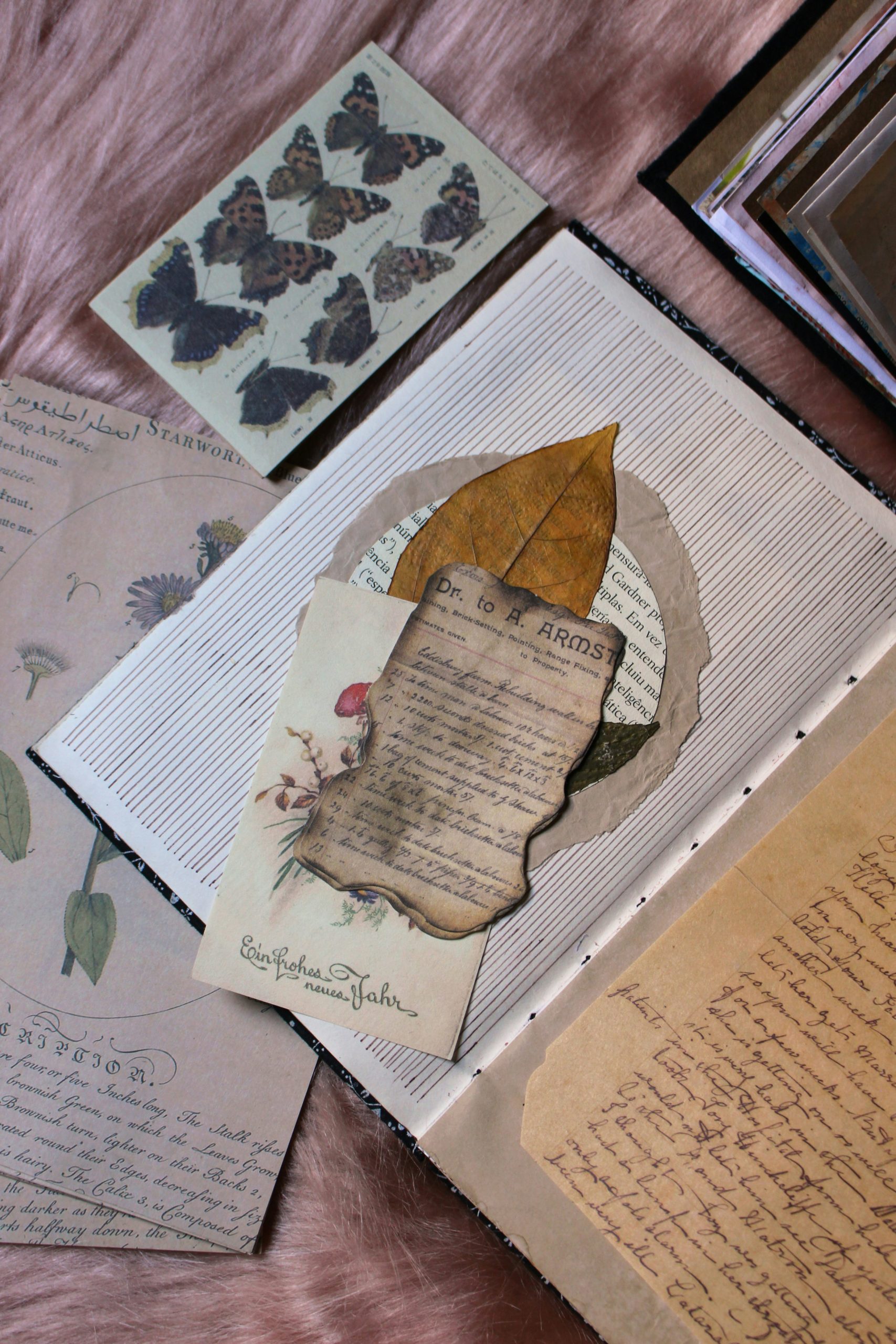 Hands arranging paper and creative journaling materials
